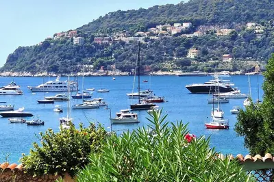 a bunch of boats in a large body of water at La Suite de Saint-Jean-Cap-Ferrat, vue mer et accès mer in Saint-Jean-Cap-Ferrat