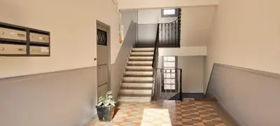 a staircase in a house with a stair case at Bright Appartment perfect location in Saint-Jean-Cap-Ferrat