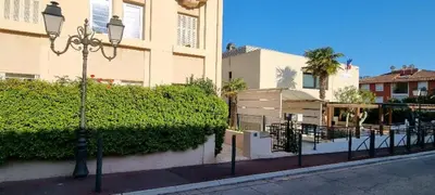 a street light in front of a building at Bright Appartment perfect location in Saint-Jean-Cap-Ferrat