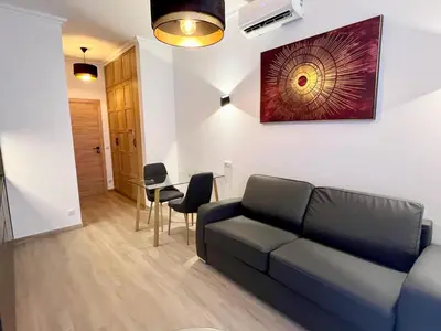 a living room with a couch and a table at Central Beautifull Delille Flat in Nice