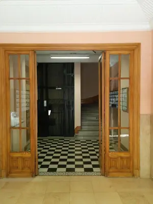 an open door with a checkered floor outside at Appartement Nice Centre Medecin in Nice