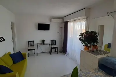 a living room with a couch and a table at Studio cosy à Nice in Nice