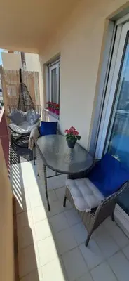 a room with a table and chairs on a balcony at Studio cosy à Nice in Nice