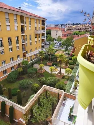 an aerial view of a courtyard in a building at Une invitation à la détente in Nice