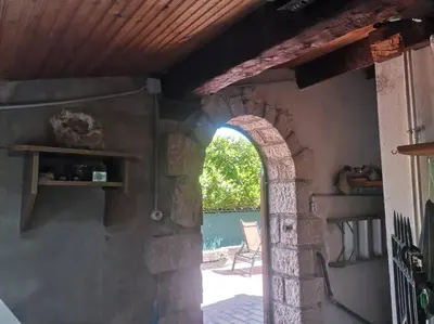 an archway in a building with a patio at Maison traditionnelle sur les collines Niçoises in Nice