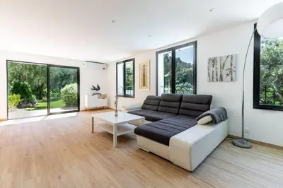 a living room with a couch and a table at Villa Summertime in Nice