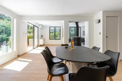 a dining room with a table and chairs at Villa Summertime in Nice