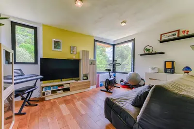 a living room with a flat screen tv and a couch at Villa Summertime in Nice