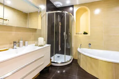 a bathroom with a shower and a tub and a sink at Villa Summertime in Nice
