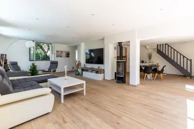 a living room with a couch and a table at Villa Summertime in Nice
