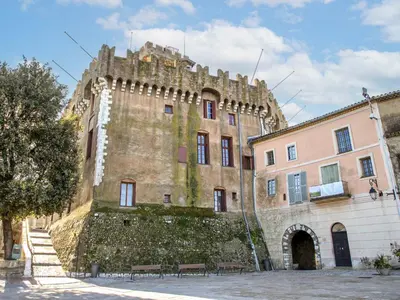 an old building with a wall and benches in front of it at Apartment Le Lagon Bleu by Interhome in Cagnes-sur-Mer