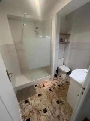 a bathroom with a shower and a toilet at Grand appartement proche Promenade in Nice
