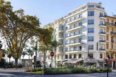 a large white building on a city street at Crisol Promenade in Nice