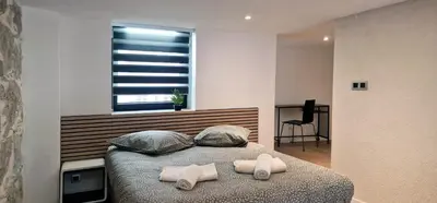a bedroom with a bed with towels on it at Très joli loft au cœur de Nice in Nice