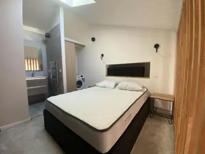 a bedroom with a bed and a bathroom at Lamartine hypercentre 503 in Nice