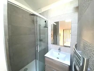 a bathroom with a shower and a sink and a mirror at Lamartine hypercentre 503 in Nice