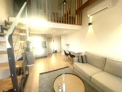 a living room with a couch and a table at Lamartine hypercentre 503 in Nice