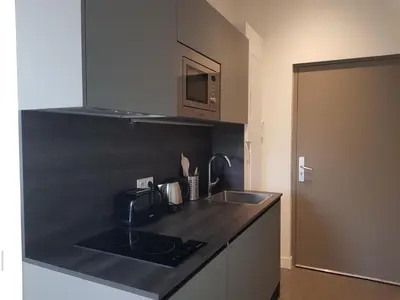 a kitchen with a sink and a counter top at Centre de Nice : Studio rénové, climatisé et calme in Nice