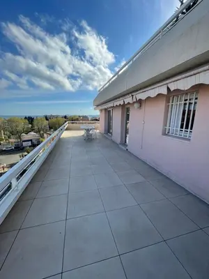 a balcony of a building with a bench on it at PENTHOUSE DUPLEX T3 SUNSEA in Cagnes-sur-Mer