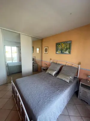 a bedroom with a large bed in a room at PENTHOUSE DUPLEX T3 SUNSEA in Cagnes-sur-Mer
