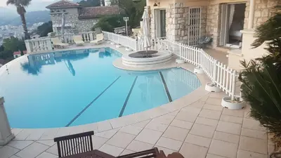 a large swimming pool in the middle of a building at Roc Maria Lucia in Nice
