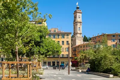 a clock tower in the middle of a city at Residence Massena in Nice