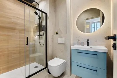 a bathroom with a shower and a toilet and a sink at Residence Massena in Nice