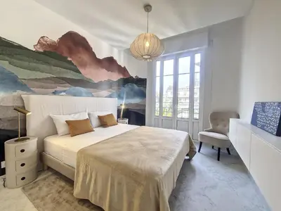 a bedroom with a bed and a painting on the wall at Nestor&Jeeves - SEAHORSE - Central - Proche mer in Nice