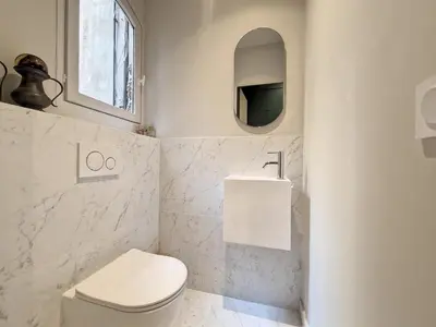 a bathroom with a toilet and a sink and a mirror at Nestor&Jeeves - SEAHORSE - Central - Proche mer in Nice