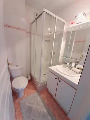 a bathroom with a toilet and a shower and a sink at studio joli in Nice