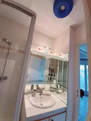 a bathroom with a sink and a mirror at studio joli in Nice