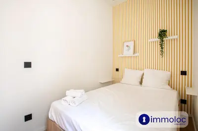a bedroom with a bed with towels on it at Air-conditioned apartment in Old Nice in Nice