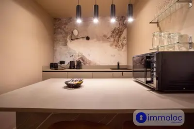 a kitchen with a counter top with a microwave at Air-conditioned apartment in Old Nice in Nice