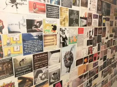 a wall with posters and pictures on it at Appartement 110m2 Nice plein centre in Nice
