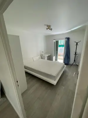 a white bedroom with a large bed in it at Suite Gloria Five stars holiday house in Nice