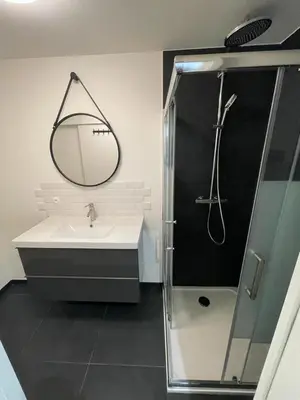 a bathroom with a sink and a shower with a mirror at Suite Gloria Five stars holiday house in Nice