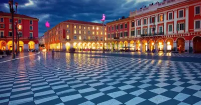 a city street with buildings and a checkered floor at Cosy 2 pieces rénové, Proche mer, 4 pers in Nice