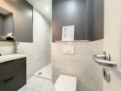 a bathroom with a toilet and a sink at Cosy 2 pieces rénové, Proche mer, 4 pers in Nice