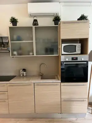 a kitchen with a sink and a microwave at BEAUTIFUL apartment , beach 3 min walk , free parking, near Negresco in Nice