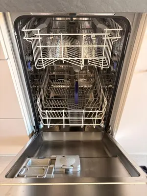 an empty dishwasher with its door open at Charmant apt calme - proche plage et aéroport - climatisé - parking privé gratuit in Cagnes-sur-Mer
