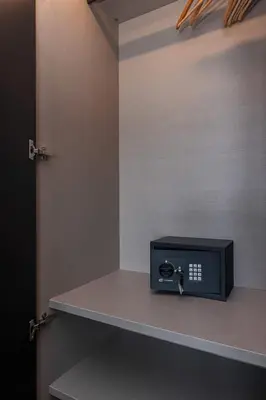 a microwave sitting on a shelf in a room at MY CASA - HSAUVAN - Villa Design Swimming Pool Sea View in Saint-Jean-Cap-Ferrat