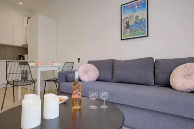 a living room with a couch and a table with wine glasses at Maison Bianchi - Jaures Old Town in Nice