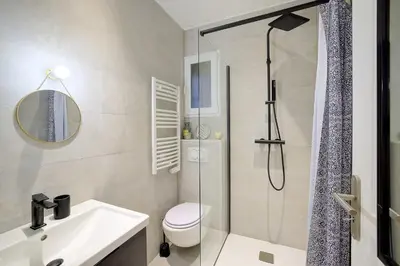 a bathroom with a shower and a toilet and a sink at Maison Bianchi - Jaures Old Town in Nice