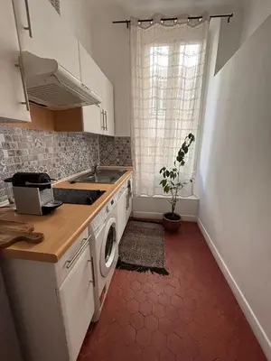 a kitchen with a sink and a washing machine at Studio Au coeur de Nice in Nice