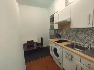 a kitchen with a sink and a washing machine at Studio Au coeur de Nice in Nice