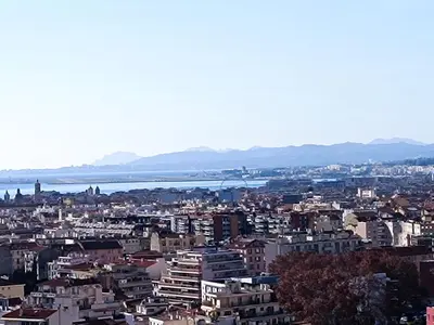 a view of a city with a river and buildings at Double room with great view in Nice