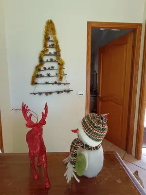 a christmas tree on a wall with a snowman at Double room with great view in Nice