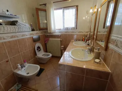 a bathroom with two sinks and a toilet at Double room with great view in Nice