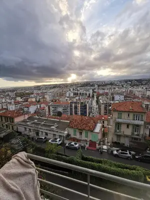 a view of a city with cars on a street at Double room with great view in Nice