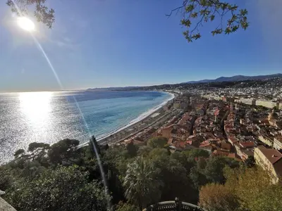 a view of a beach with houses and the ocean at Double room with great view in Nice